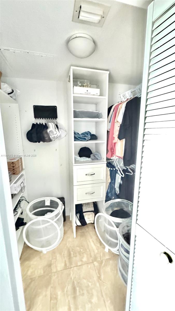 1800 North Bayshore Drive, Unit 1906 Miami, FL 33132 - Photo 20 of 21 a bathroom with a sink and a mirror