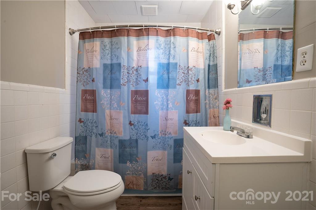 2289 Claremont Road Newton, NC 28658 - Photo 15 of 20 a bathroom with a sink a toilet and shower