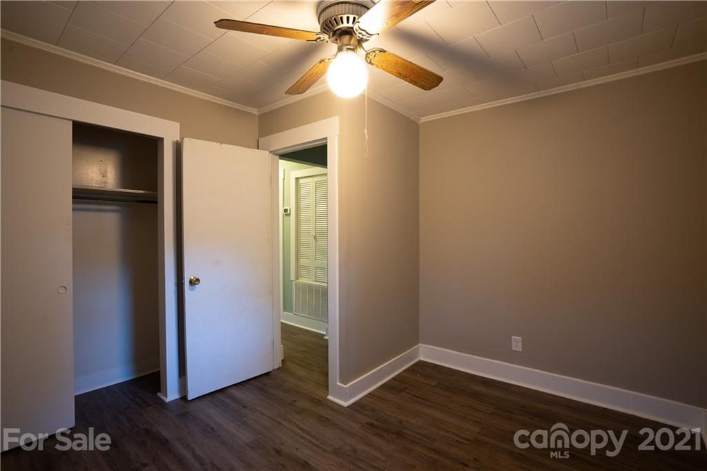 2289 Claremont Road Newton, NC 28658 - Photo 19 of 20 a view of an empty room with wooden floor