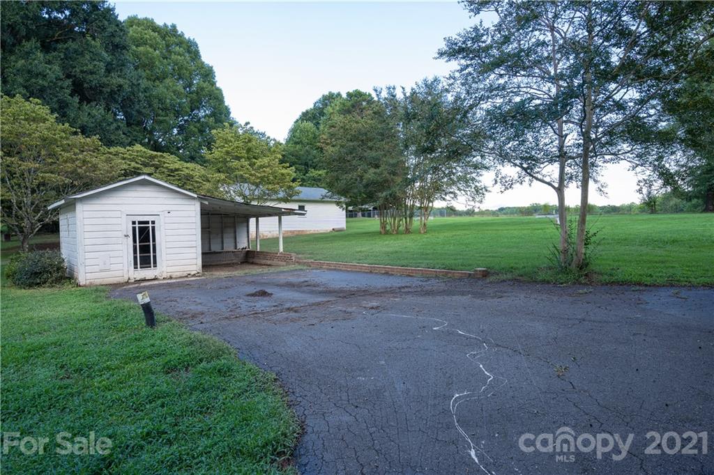 2289 Claremont Road Newton, NC 28658 - Photo 6 of 20 a view of a house with yard and a garden