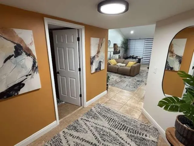 a living room with furniture and a rug