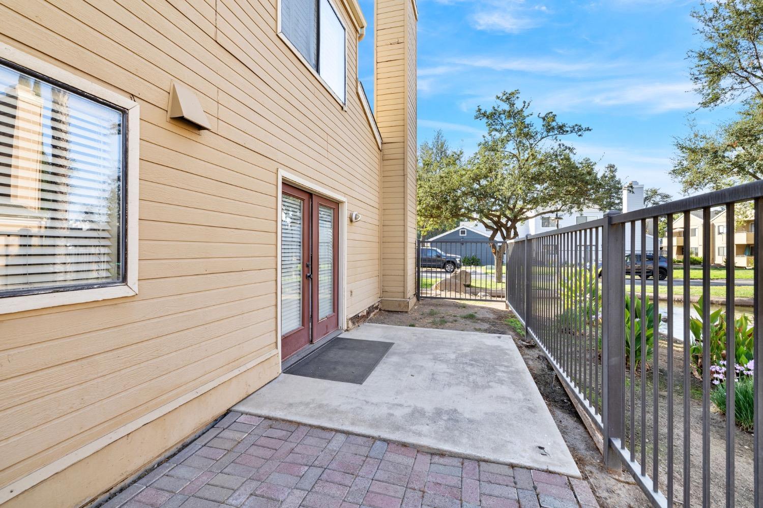 7675 North First Street, Unit 136 Fresno, CA 93720 - Photo 25 of 42 a view of a pathway with a house