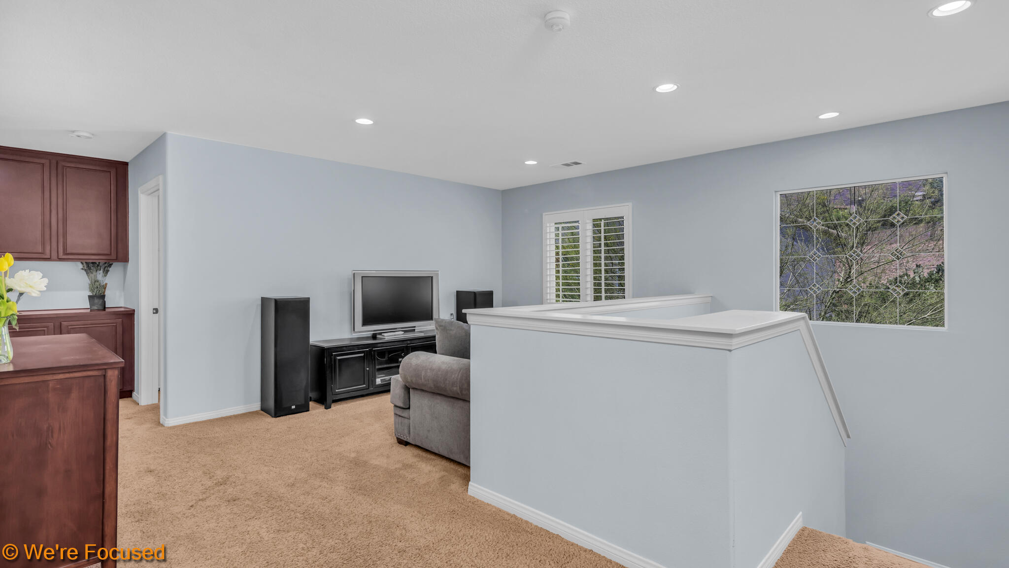33856 Augusta Circle Yucaipa, CA 92399 - Photo 13 of 55 a living room with furniture a flat screen tv and a refrigerator