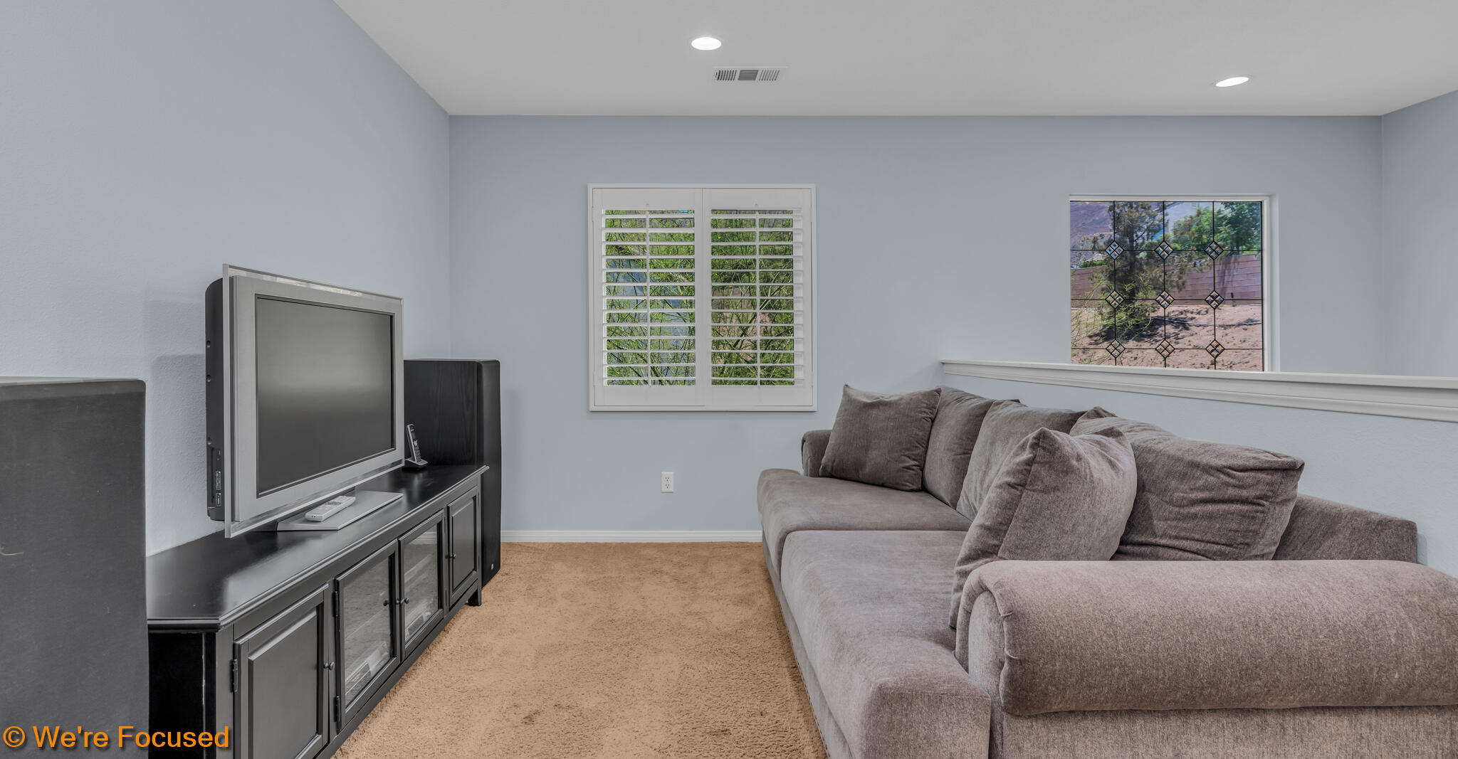 33856 Augusta Circle Yucaipa, CA 92399 - Photo 14 of 55 a living room with furniture and a flat screen tv