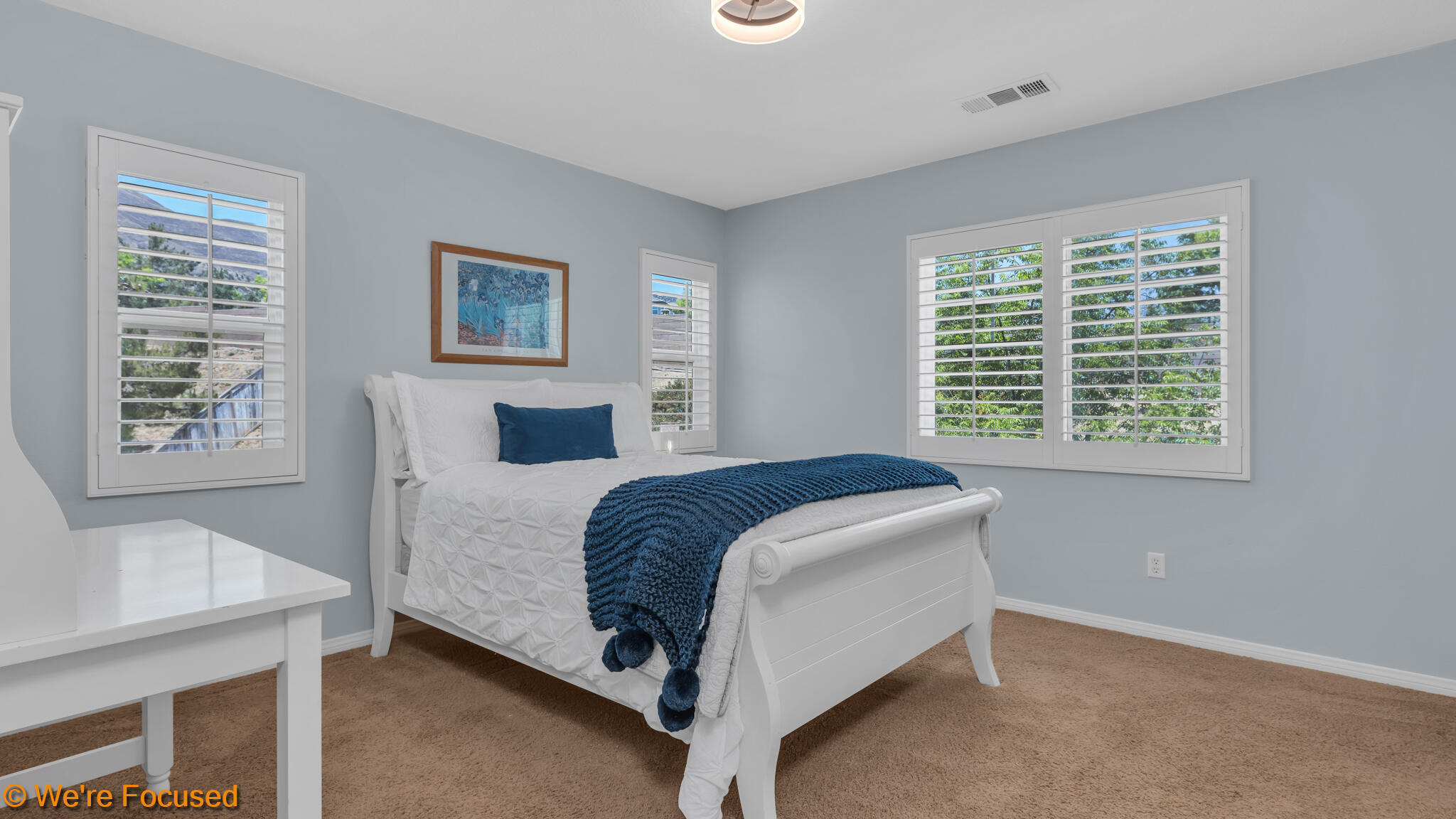 33856 Augusta Circle Yucaipa, CA 92399 - Photo 15 of 55 a bedroom with a bed and a table in it