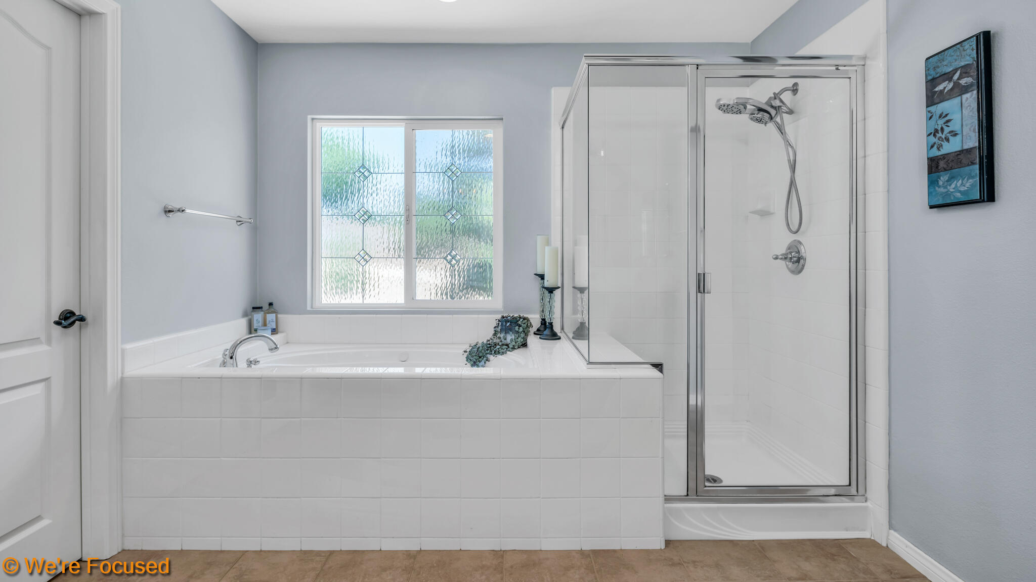 33856 Augusta Circle Yucaipa, CA 92399 - Photo 23 of 55 a bathroom with a bathtub and shower