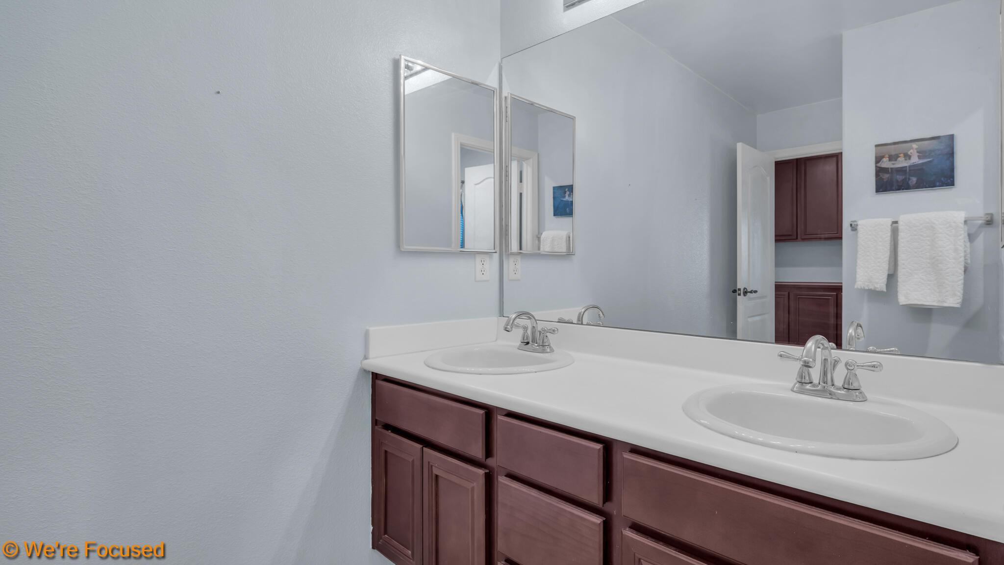 33856 Augusta Circle Yucaipa, CA 92399 - Photo 28 of 55 a bathroom with a sink and a mirror