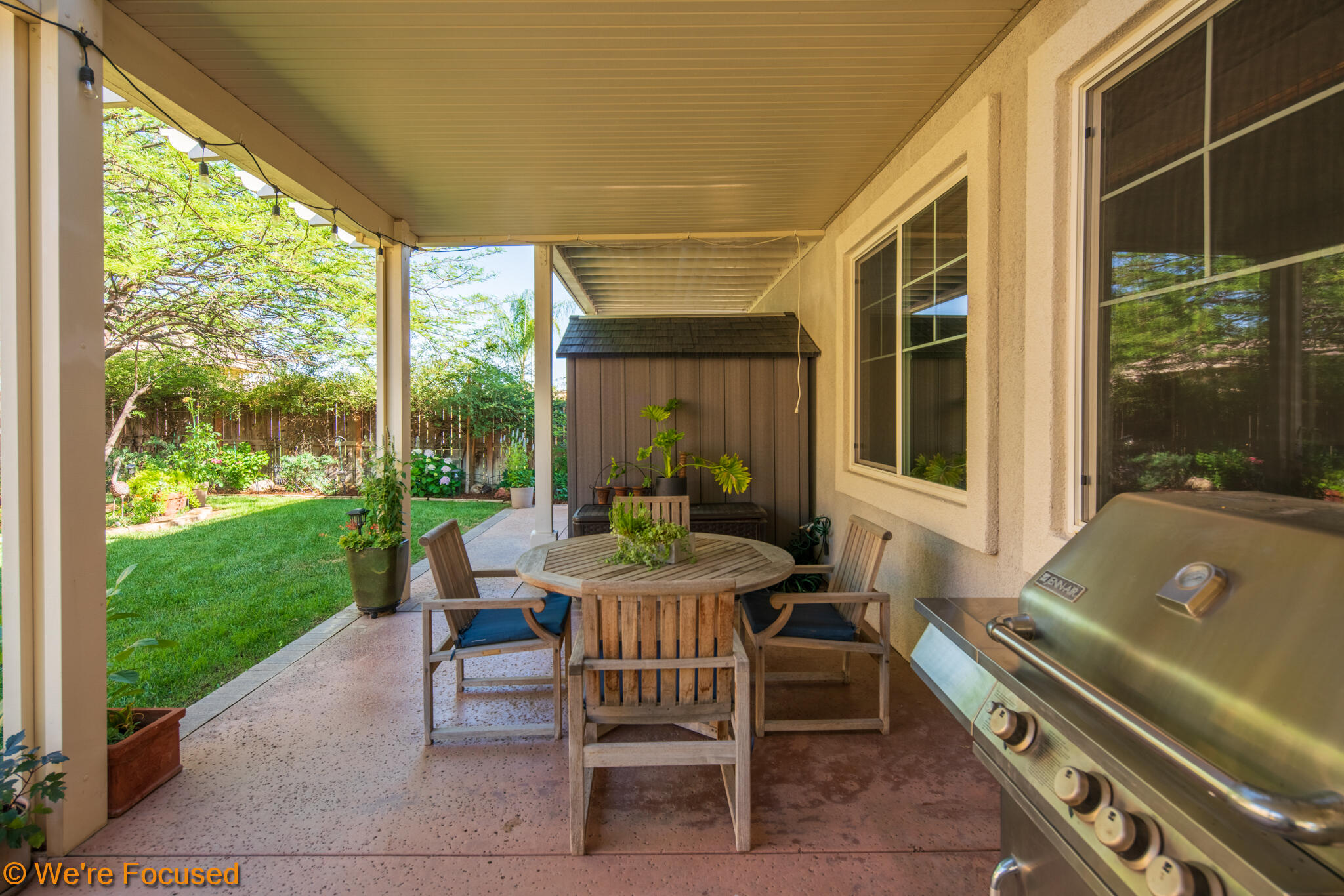 33856 Augusta Circle Yucaipa, CA 92399 - Photo 31 of 55 a view of a patio with a table chairs and a backyard
