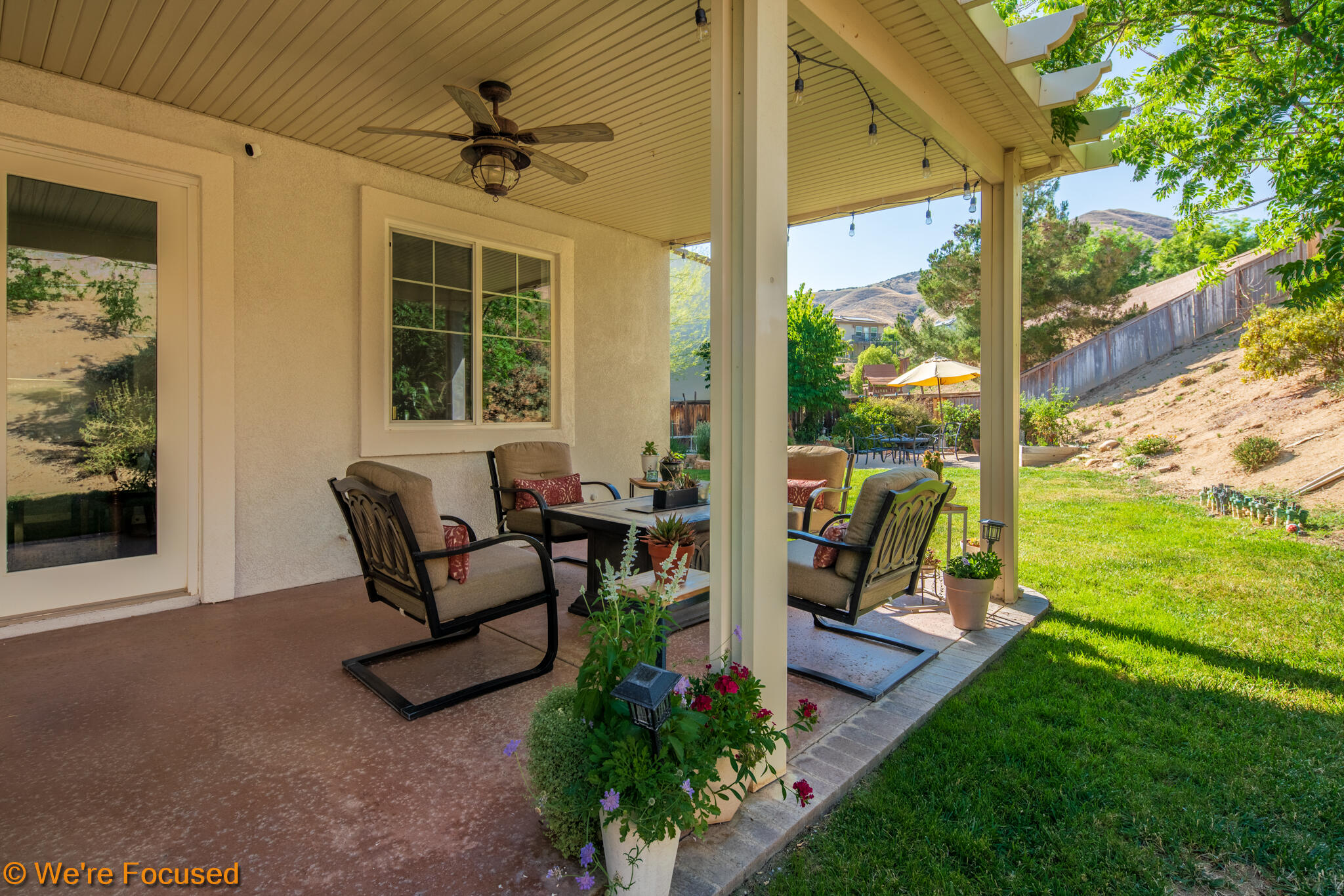 33856 Augusta Circle Yucaipa, CA 92399 - Photo 35 of 55 a view of a porch with furniture and a yard