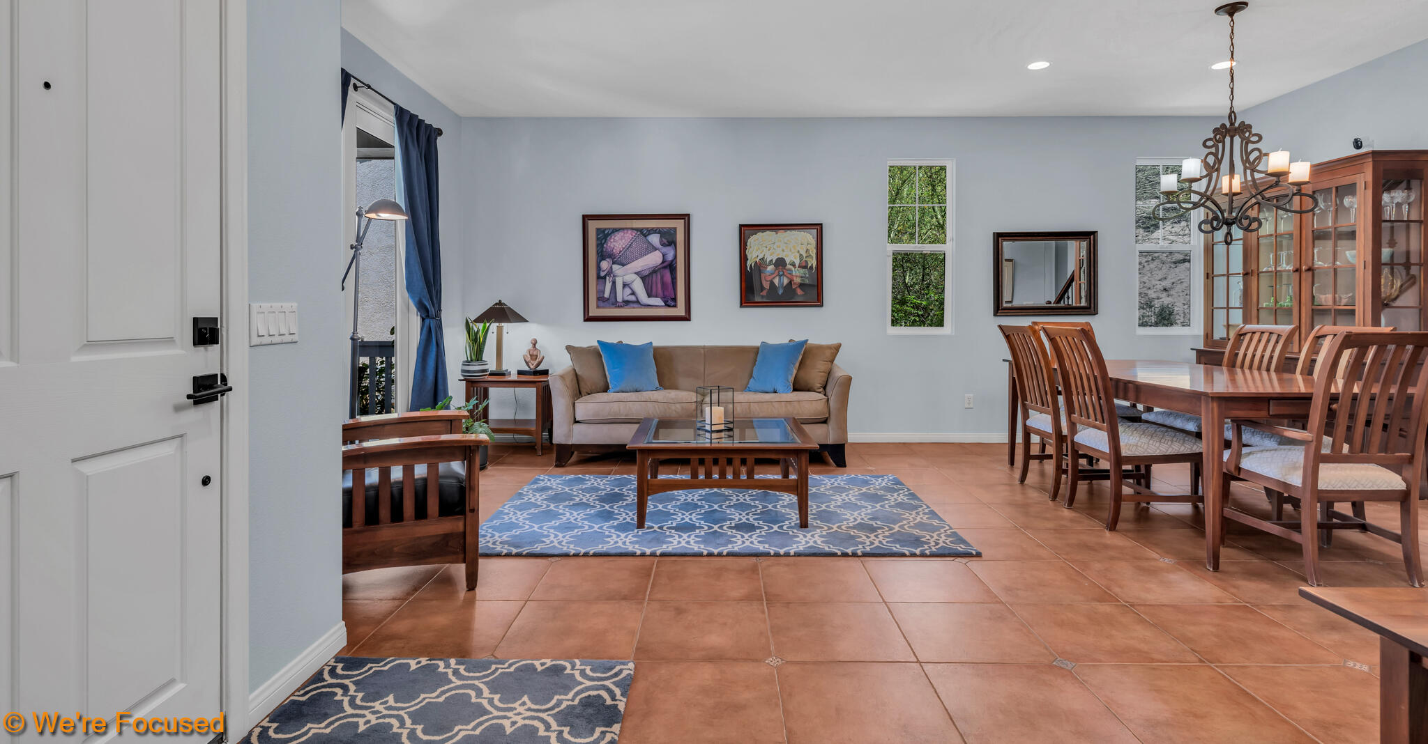 33856 Augusta Circle Yucaipa, CA 92399 - Photo 5 of 55 a living room with furniture a dining table and a chandelier