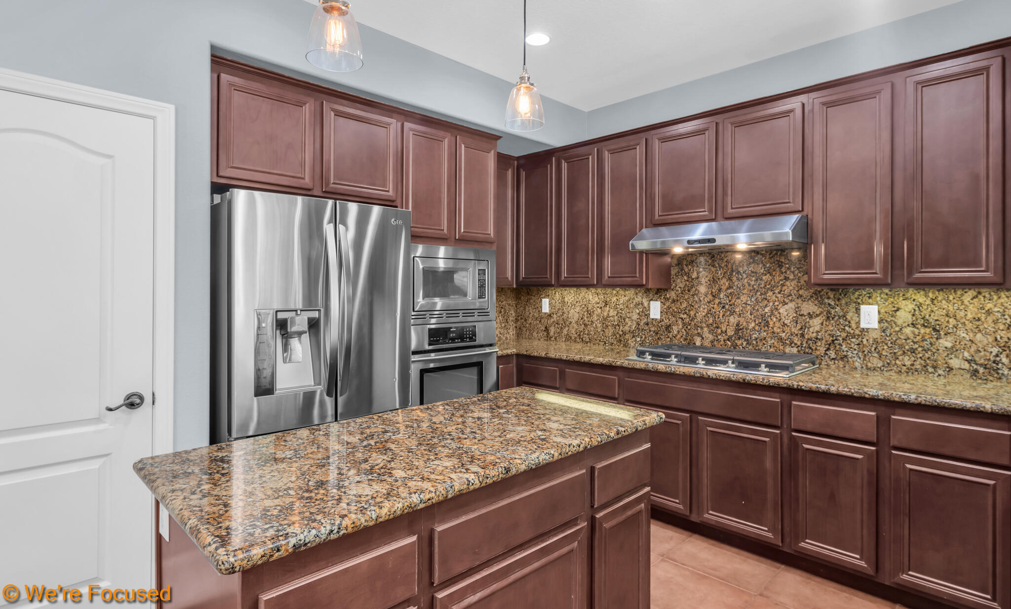 33856 Augusta Circle Yucaipa, CA 92399 - Photo 8 of 55 a kitchen with stainless steel appliances granite countertop a refrigerator and a sink