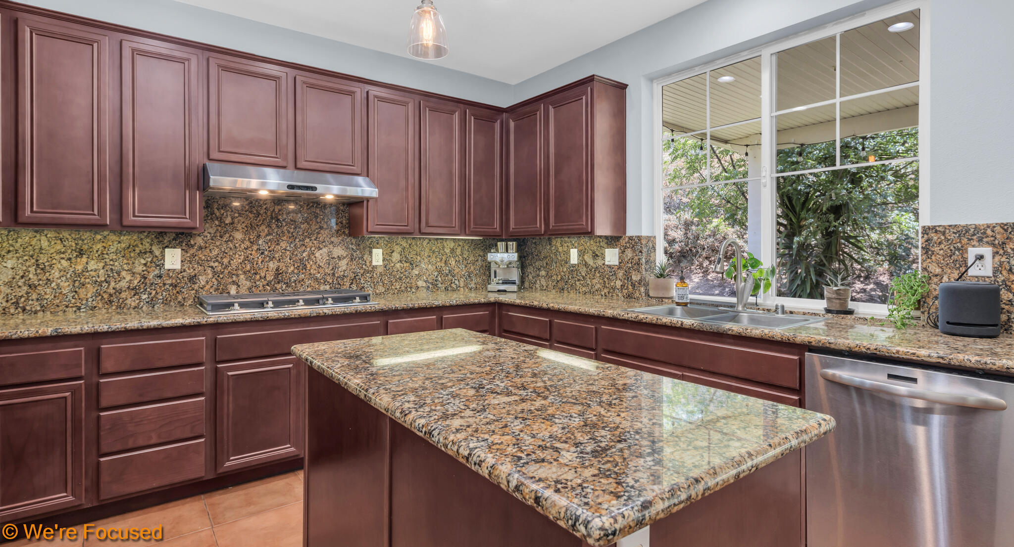 33856 Augusta Circle Yucaipa, CA 92399 - Photo 9 of 55 a kitchen with granite countertop wooden cabinets a sink and dishwasher