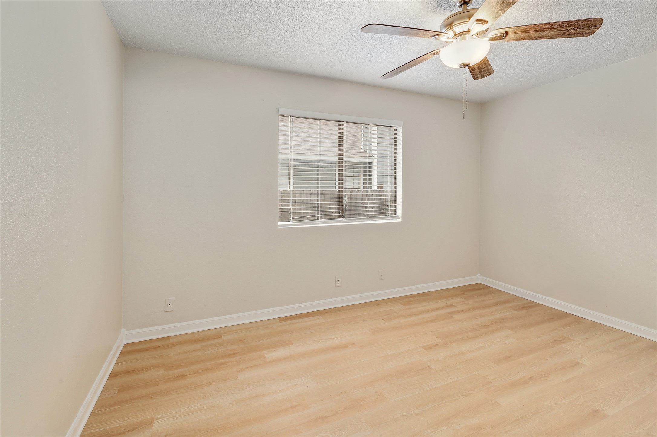 1915 Margalene Way Austin, TX 78728 - Photo 13 of 23 an empty room with windows and fan
