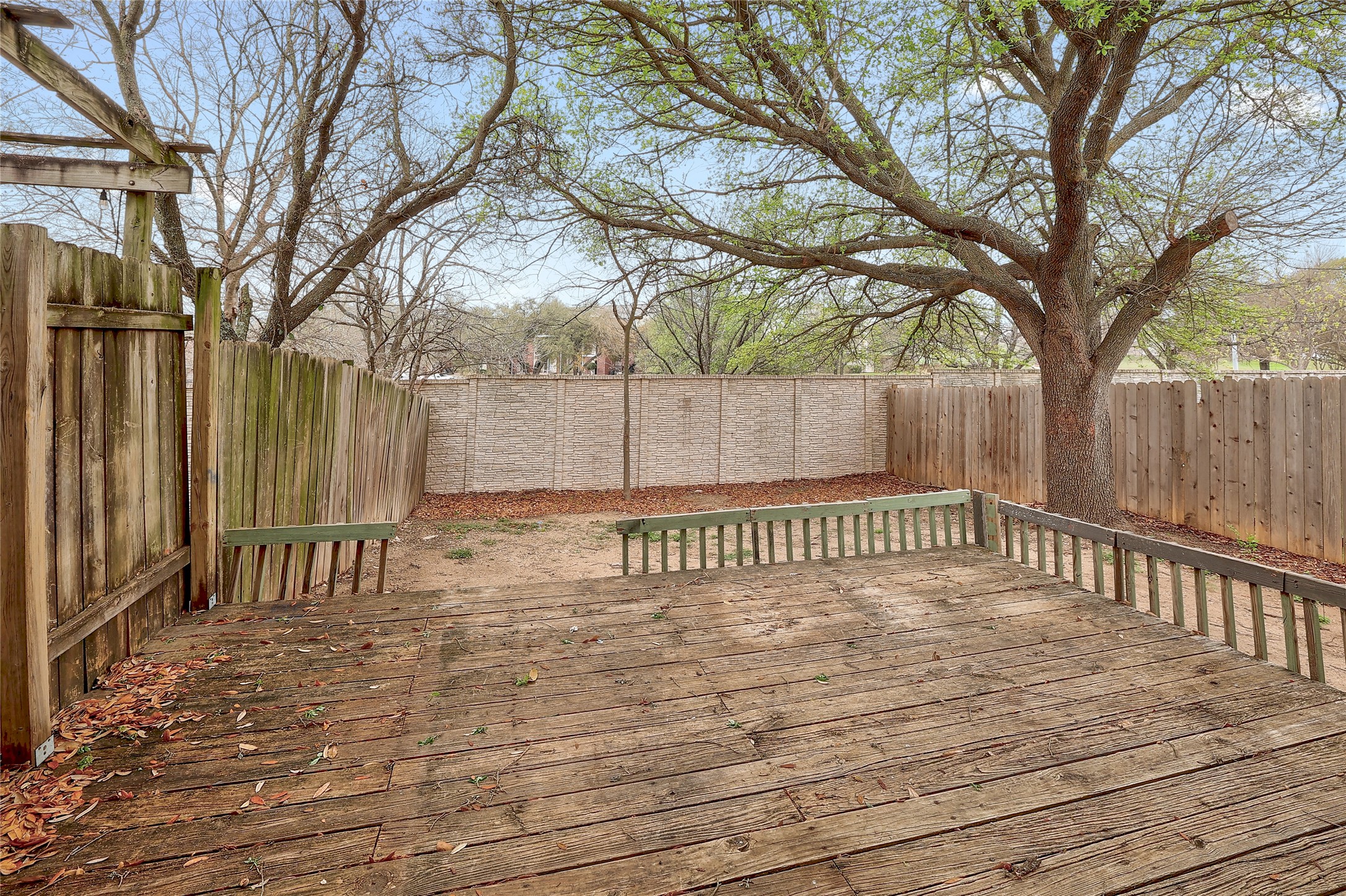 1915 Margalene Way Austin, TX 78728 - Photo 20 of 23 a view of deck with a large trees