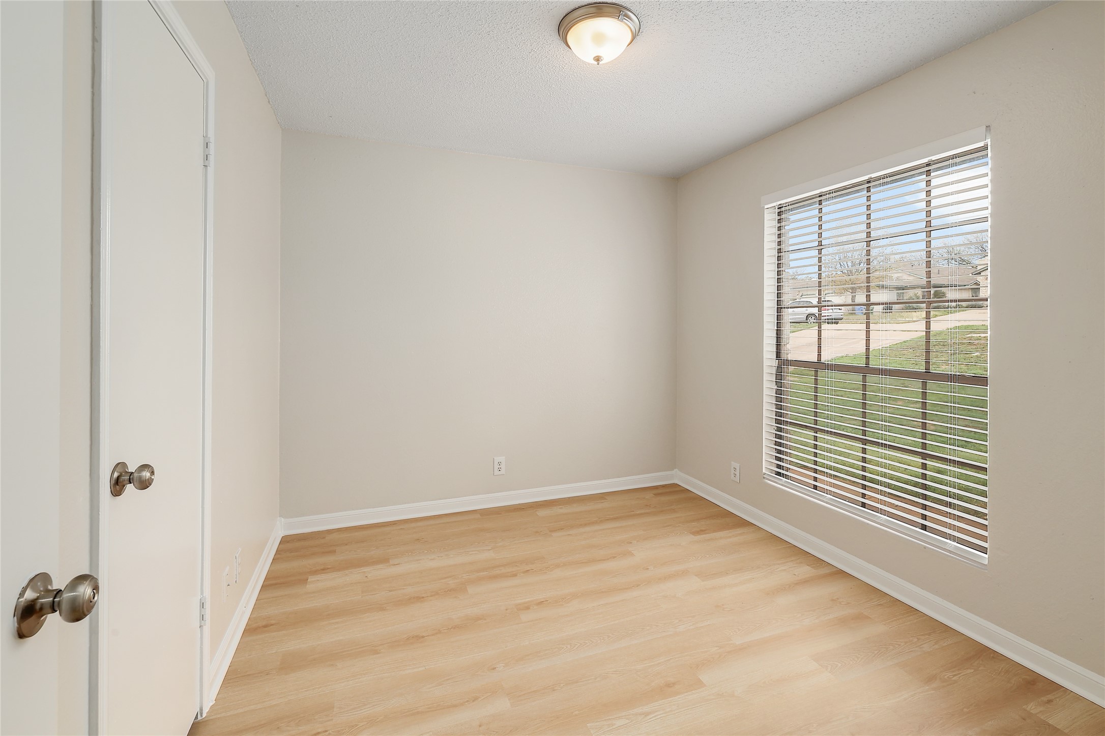 1915 Margalene Way Austin, TX 78728 - Photo 2 of 23 an empty room with windows