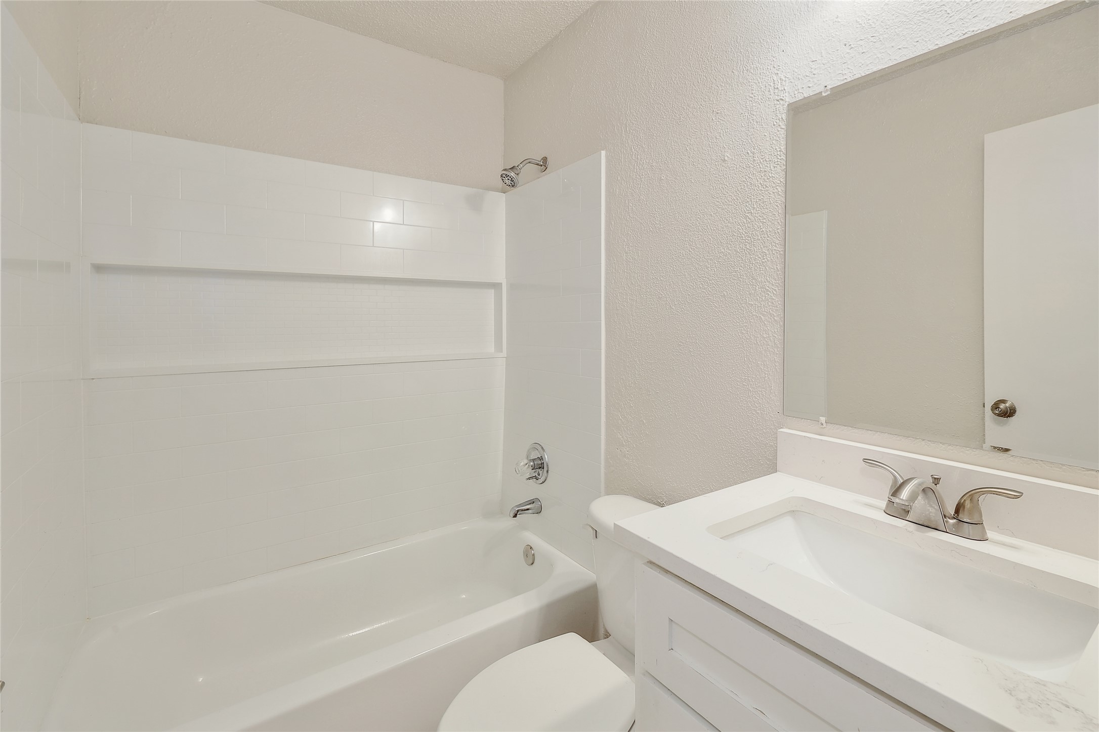 1915 Margalene Way Austin, TX 78728 - Photo 3 of 23 a bathroom with a bathtub and a sink