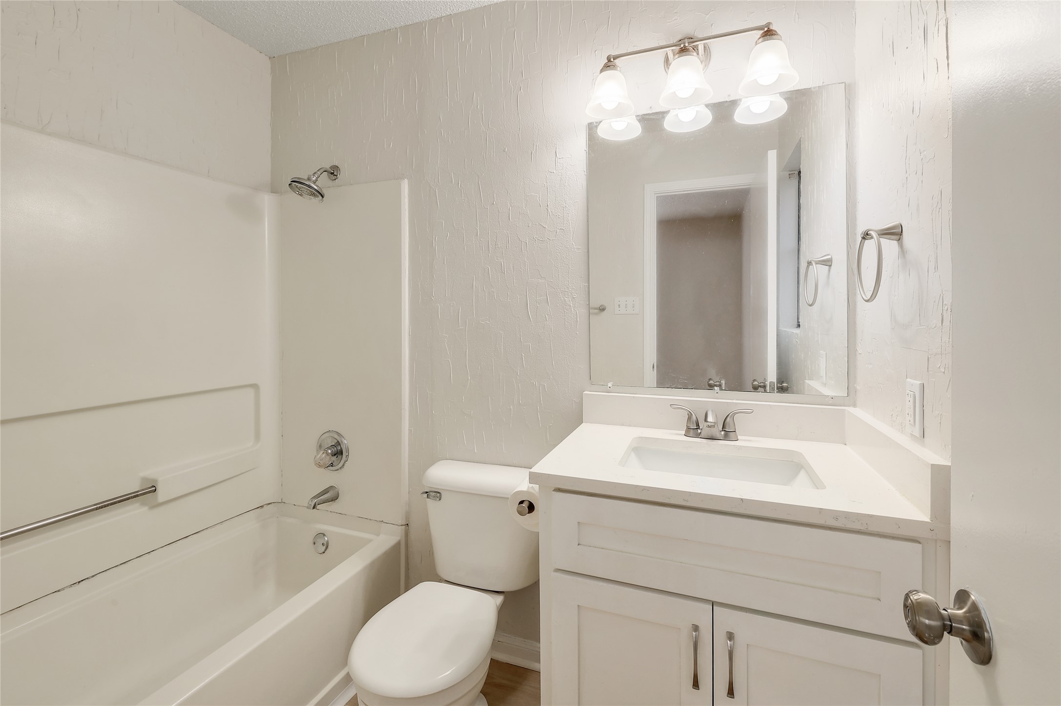 1915 Margalene Way Austin, TX 78728 - Photo 4 of 23 a bathroom with a sink a toilet and shower