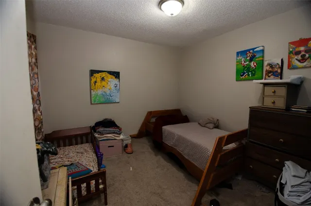 a bedroom with a bed and furniture