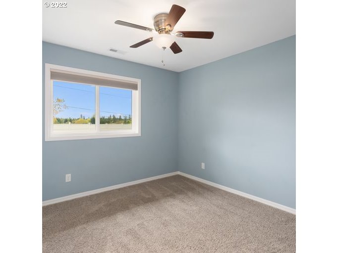 208 Northeast Carty Road Ridgefield, WA 98642 - Photo 19 of 32 a view of an empty room with a window