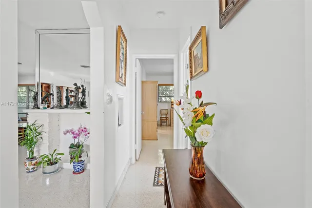 a view of living room with furniture and wooden floor