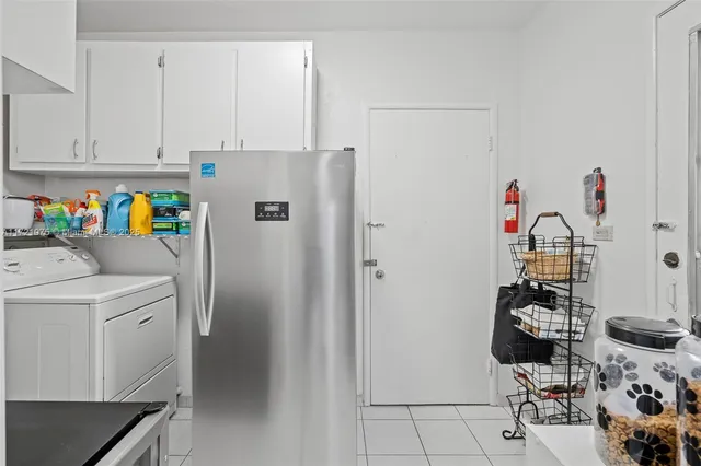a view of storage and utility room with washer and dryer