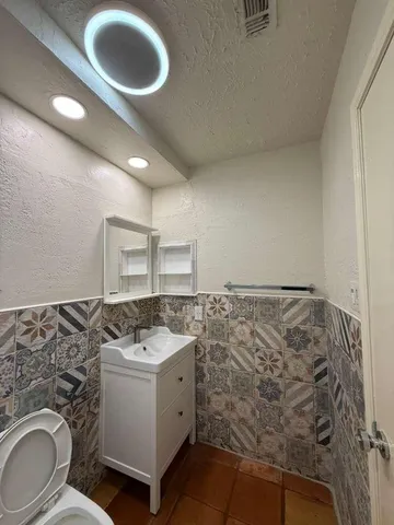 a bedroom with a bed and a couch