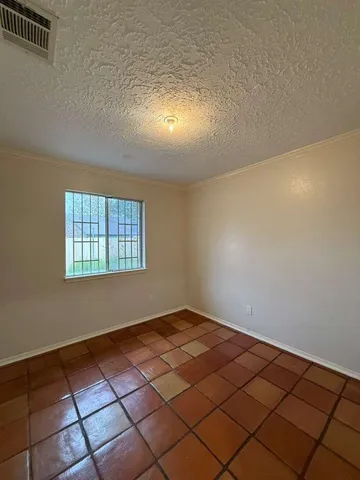 a view of a livingroom with a projector and furniture