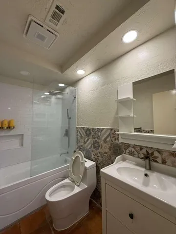 a bathroom with a sink and mirror