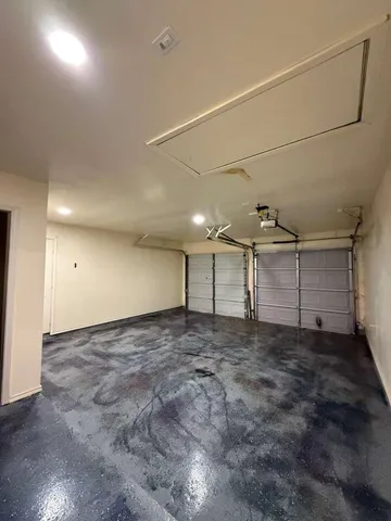 a front view of a house with a garage