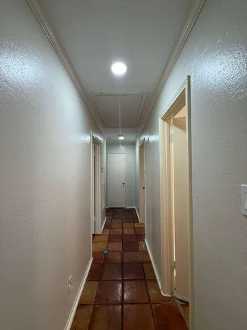 a open kitchen with cabinets and stainless steel appliances