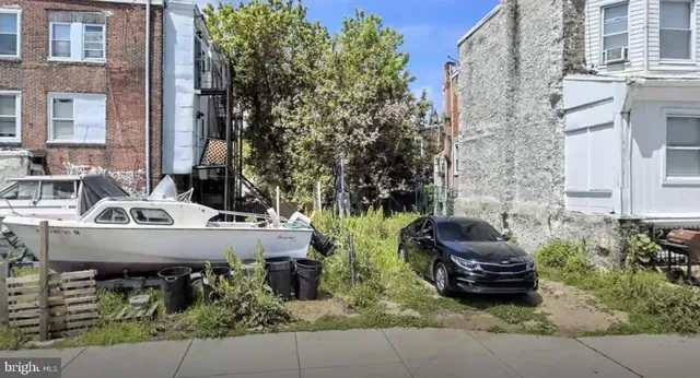 a view of house with patio and outdoor seating