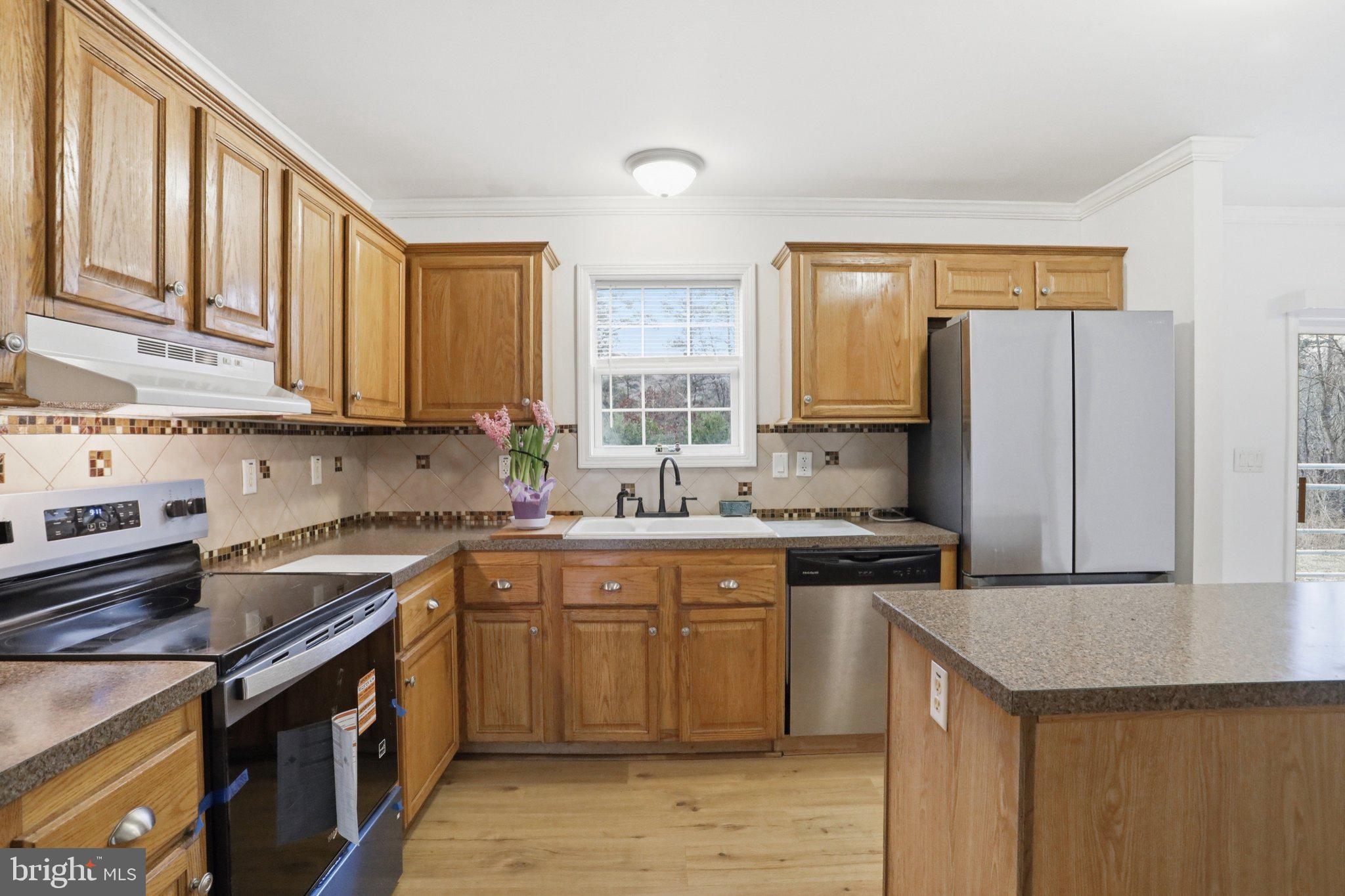 271 Packing Shed Road Berkeley Springs, WV 25411 - Photo 6 of 38 Bright and inviting kitchen space.