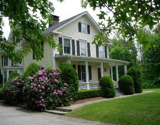 218 Danbury Road Wilton, CT 06897 - Photo 1 of 1 a front view of house with a garden