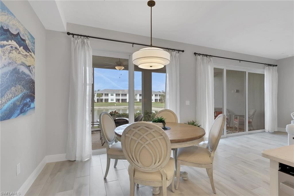 2647 Seychelles Circle, Unit 2202 Naples, FL 34112 - Photo 11 of 37 Dining space with light wood finished floors