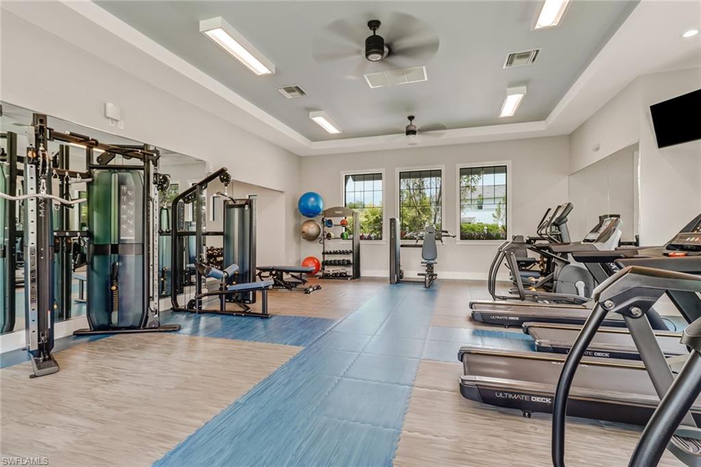 2647 Seychelles Circle, Unit 2202 Naples, FL 34112 - Photo 27 of 37 Workout area with a ceiling fan