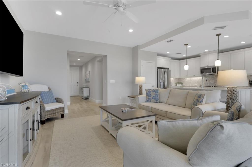 2647 Seychelles Circle, Unit 2202 Naples, FL 34112 - Photo 4 of 37 Living room with recessed lighting, ceiling fan, and light wood-type flooring