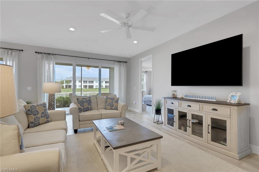 2647 Seychelles Circle, Unit 2202 Naples, FL 34112 - Photo 6 of 37 Living area with ceiling fan and recessed lighting