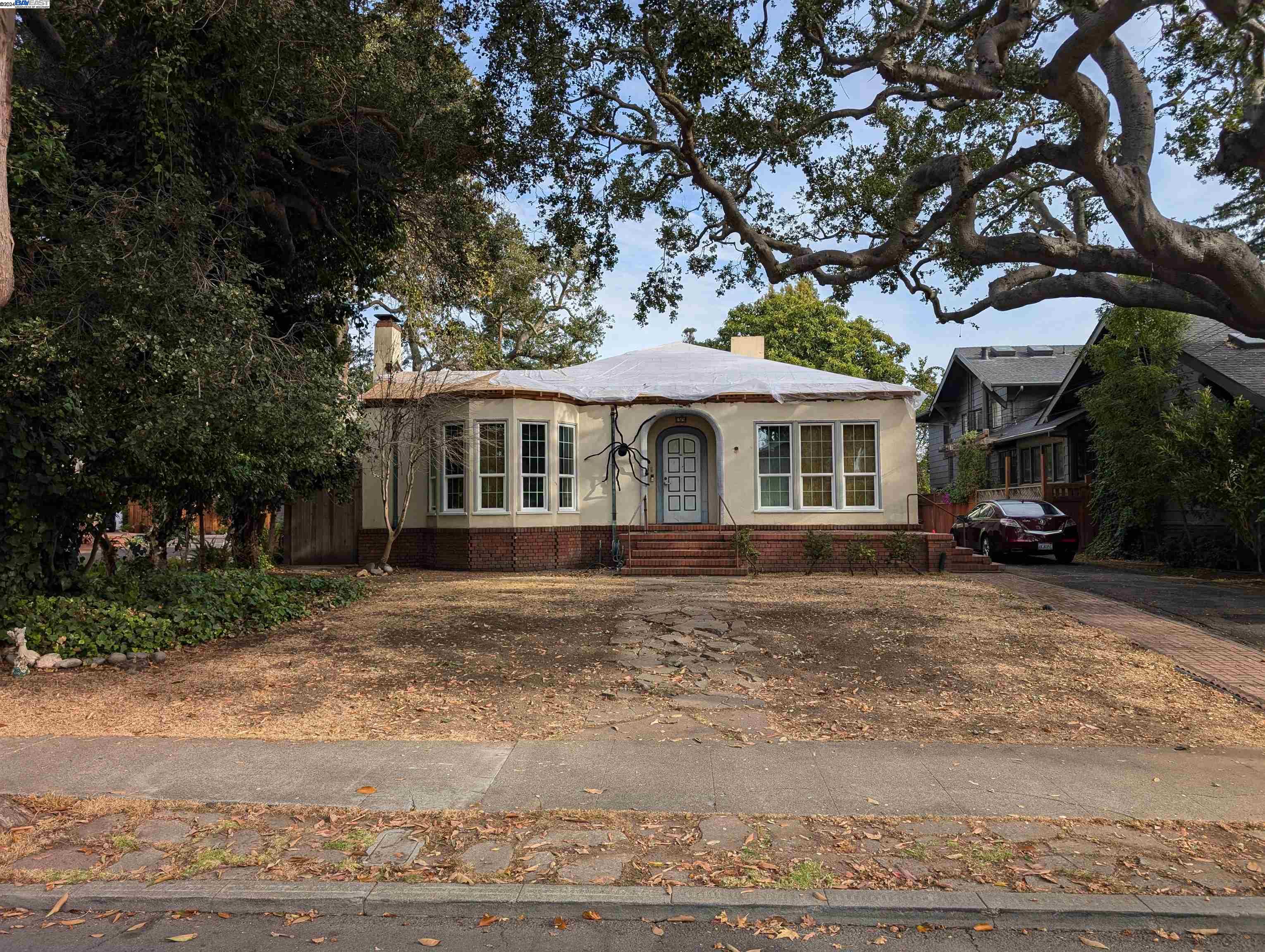 1319 Clinton Avenue Alameda, CA 94501 - Photo 1 of 1 a front view of a house with a garden