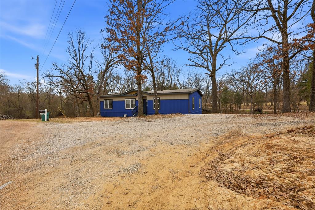 2114 Hickory Street Mabank, TX 75156 - Photo 28 of 31 Front of Home on a spacious, treed lot