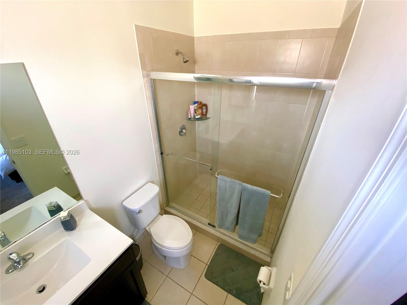11489 Southwest 250th Street, Unit 11489 Homestead, FL 33032 - Photo 20 of 24 a bathroom with a sink and toilet