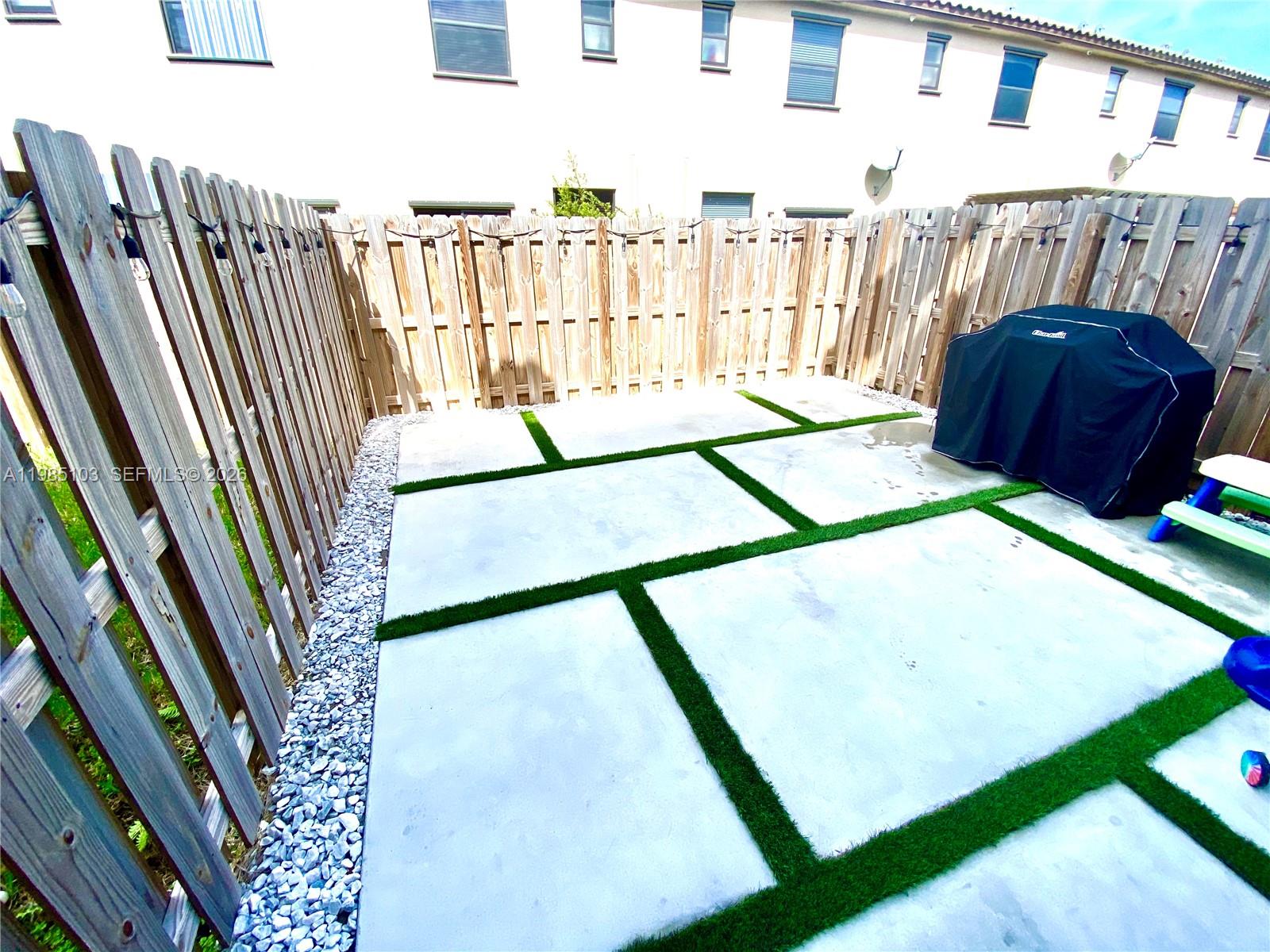 11489 Southwest 250th Street, Unit 11489 Homestead, FL 33032 - Photo 7 of 24 a view of an entryway with a small yard