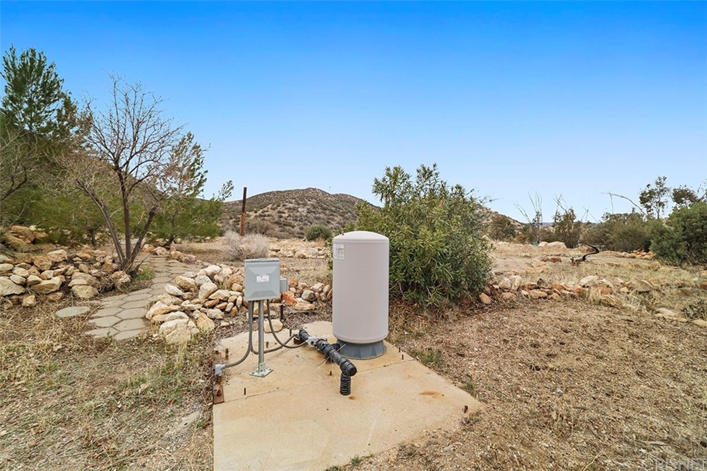 30231 Aliso Canyon Road Palmdale, CA 93550 - Photo 6 of 38 a view of a backyard with sitting area and slide