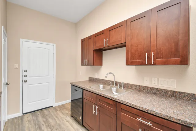 a kitchen with a sink and cabinets