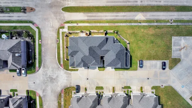 an aerial view of residential house with outdoor space and swimming pool