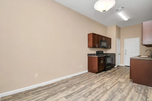 a view of kitchen with wooden floor