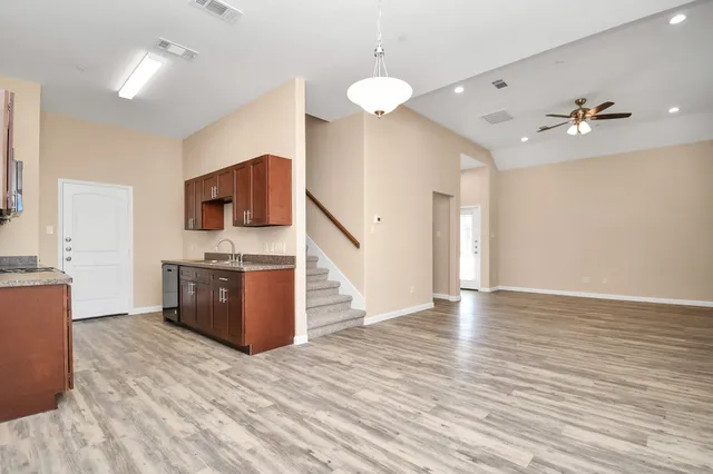 a view of kitchen with sink microwave and stove