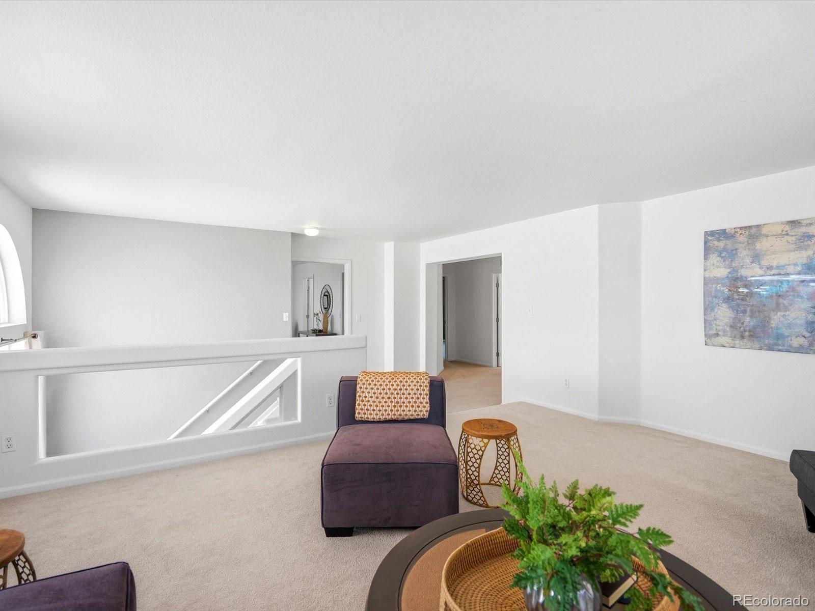 5444 Perth Court Denver, CO 80249 - Photo 22 of 46 a living room with furniture and flowers