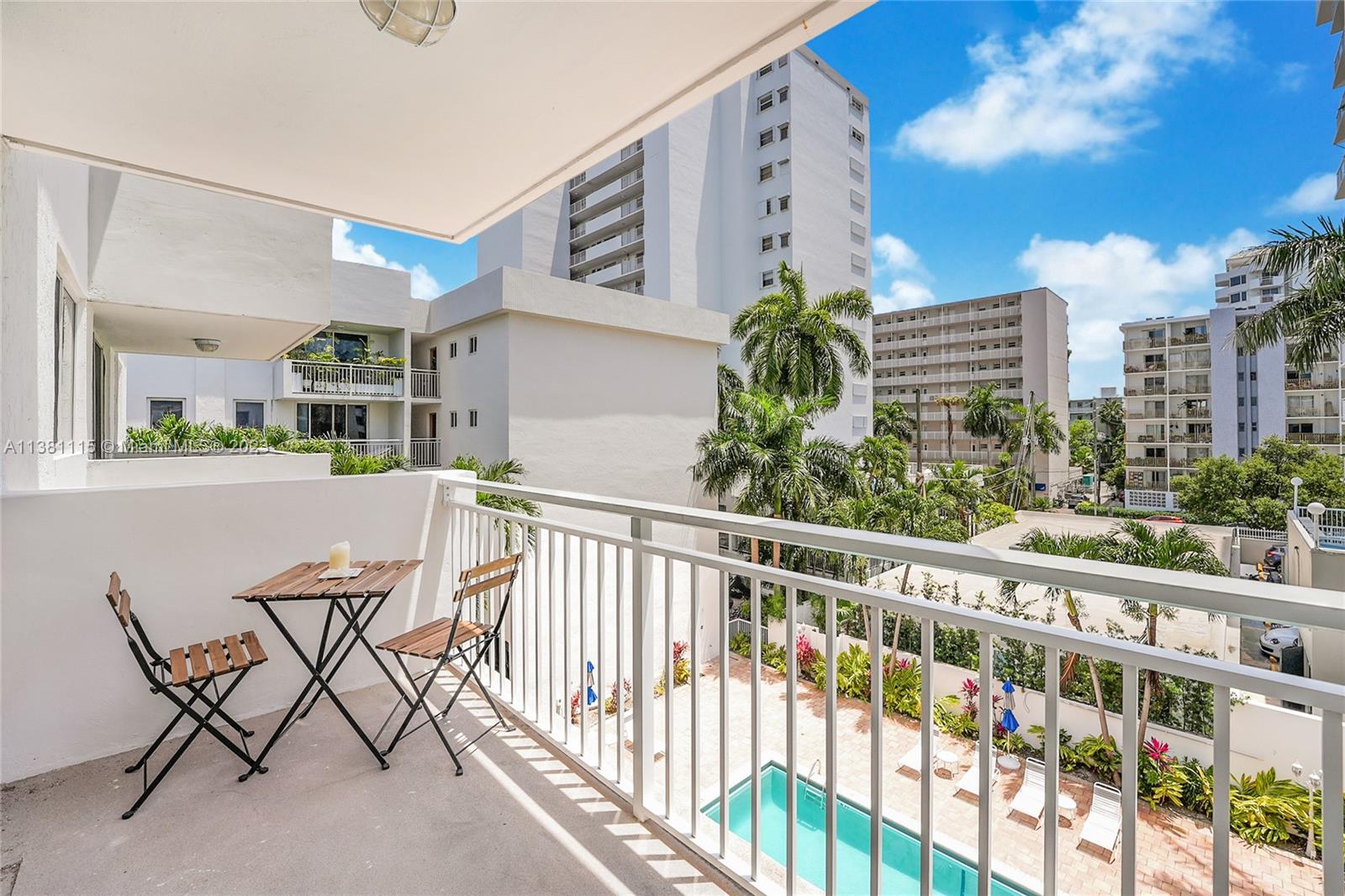 1665 Bay Road, Unit 417 Miami Beach, FL 33139 - Photo 14 of 15 a view of a balcony with furniture