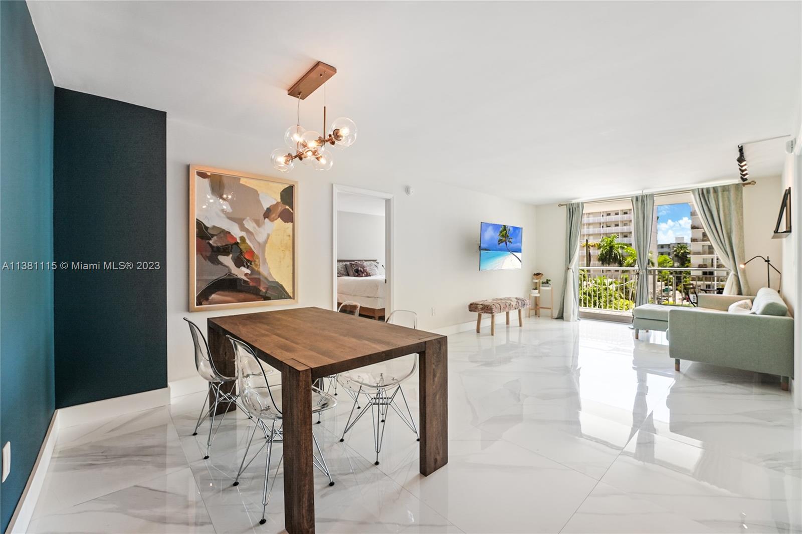 1665 Bay Road, Unit 417 Miami Beach, FL 33139 - Photo 2 of 15 a room with furniture and window