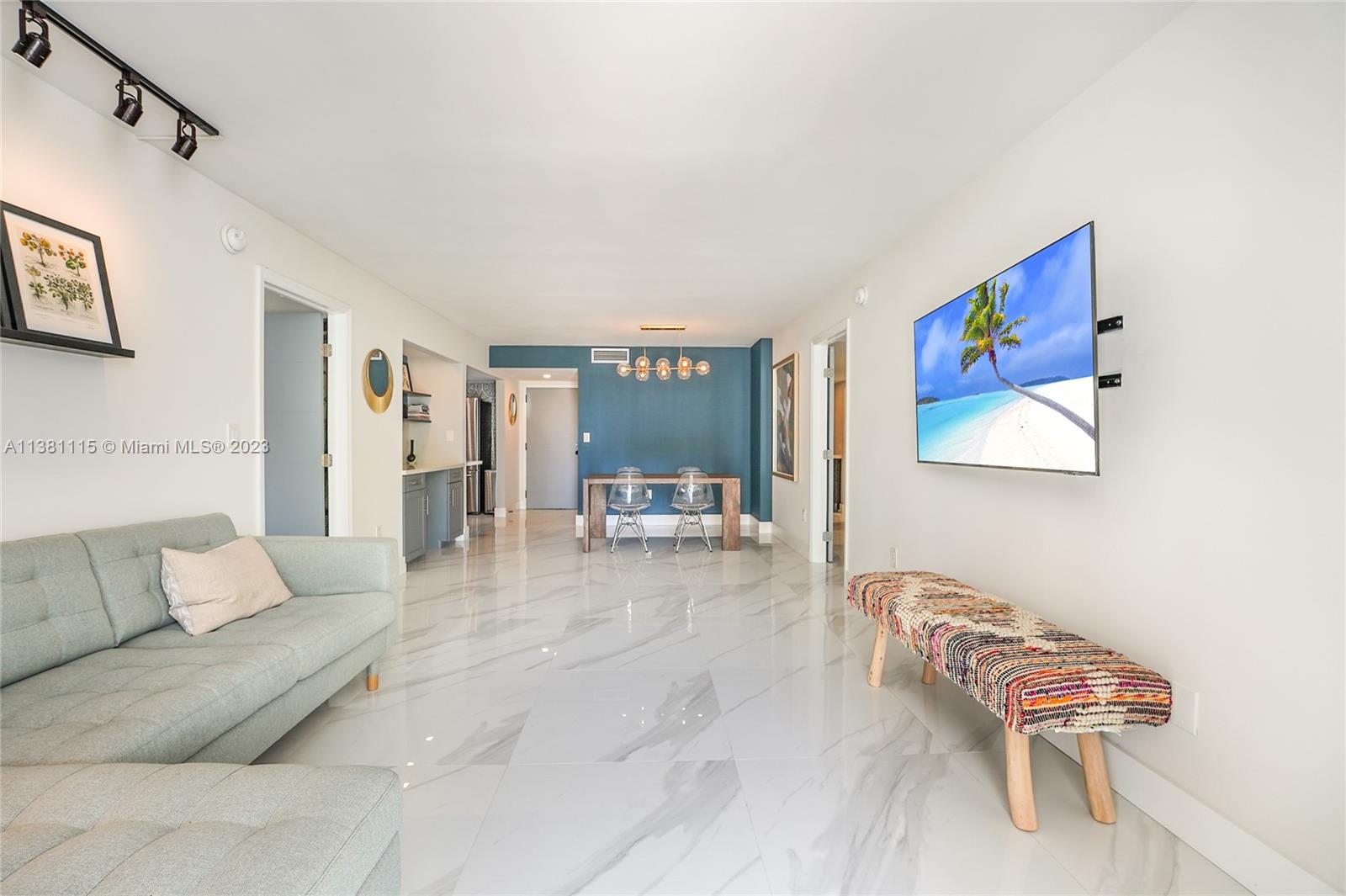 1665 Bay Road, Unit 417 Miami Beach, FL 33139 - Photo 5 of 15 a living room with furniture and a couch